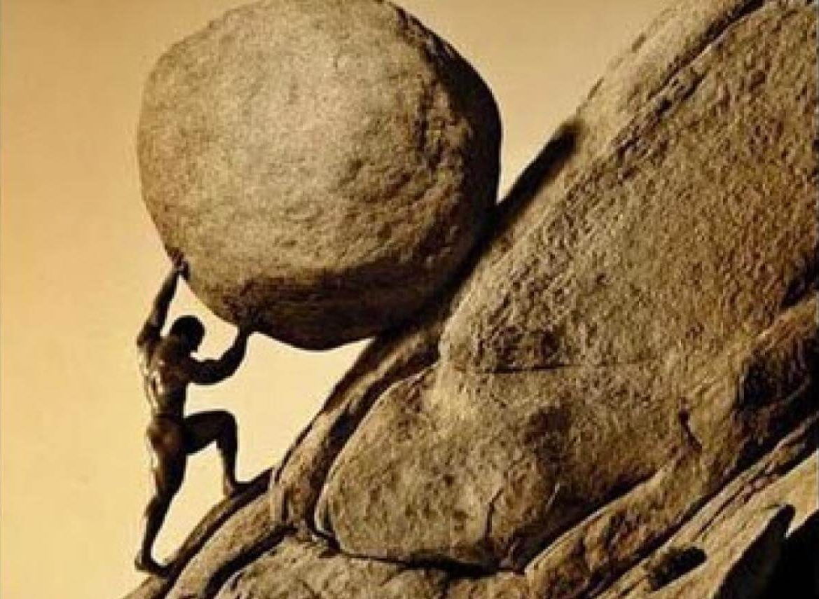 The crime that led Sisyphus to push a boulder was cheating death. He made his wife not bury him properly before he died, chained death, and tricked Persephone into letting him briefly return to earth to scold his wife and ran away instead of returning to hell.